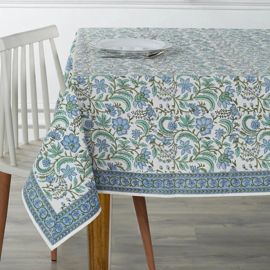 Tablecloth with floral pattern on a wooden table and chair