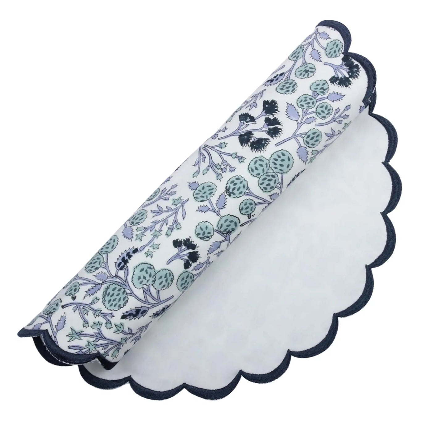 Floral-patterned napkin with scalloped edge on a white background