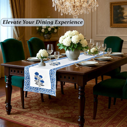 Dining room with a table set for dinner, flowers, and elegant decor.