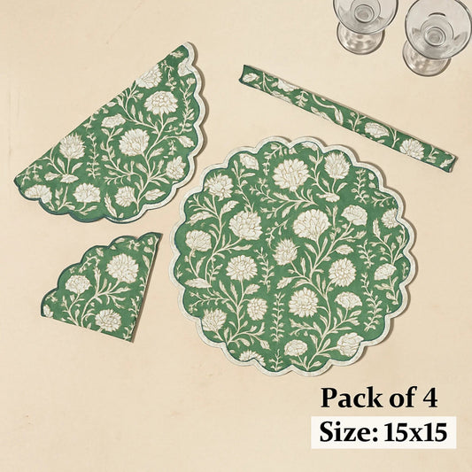 Set of green and white floral placemats on a beige background