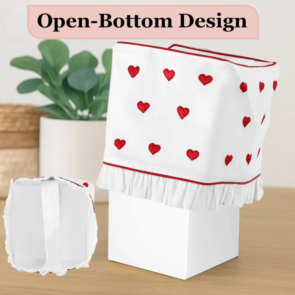 White appliance cover with red heart patterns on a wooden surface, with text &