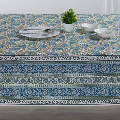 Decorative tablecloth with floral pattern on a wooden table