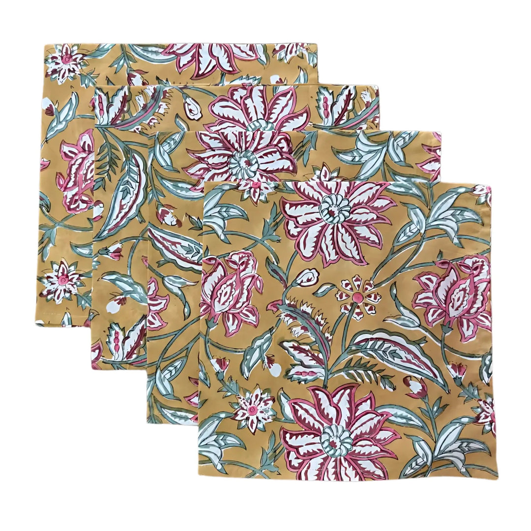 Set of three floral-patterned napkins on a beige background