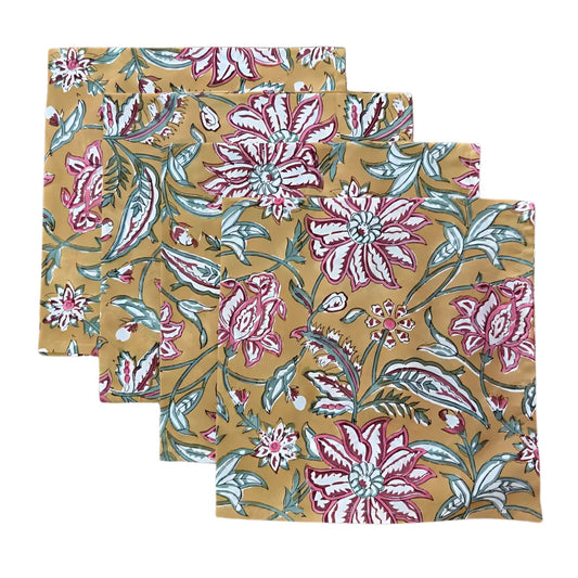 Set of three floral-patterned napkins on a beige background