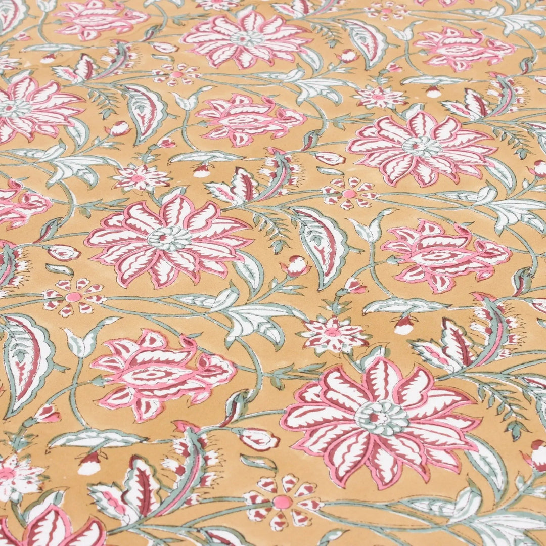 Floral pattern with pink flowers and green leaves on a beige background