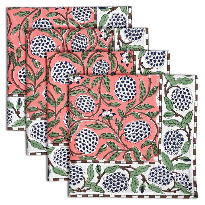 Set of three fabric swatches with a floral pattern featuring pomegranates on a white background.