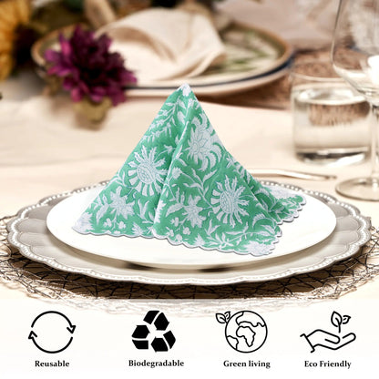 Green and white patterned napkin on a plate with table setting and eco-friendly icons.