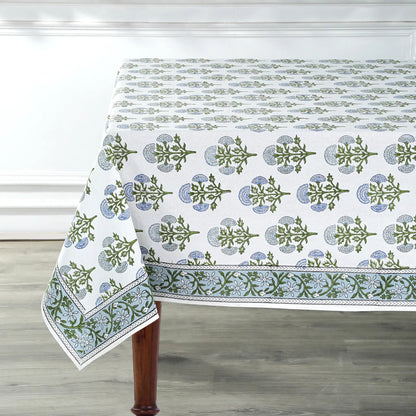 Tablecloth with green floral pattern on a wooden table