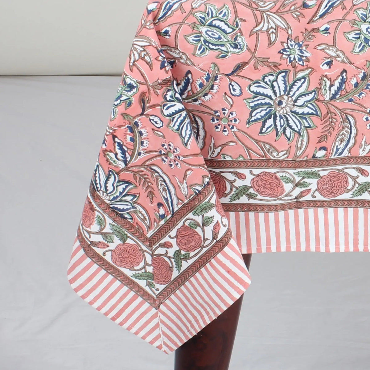 Floral and striped fabric on a gray background