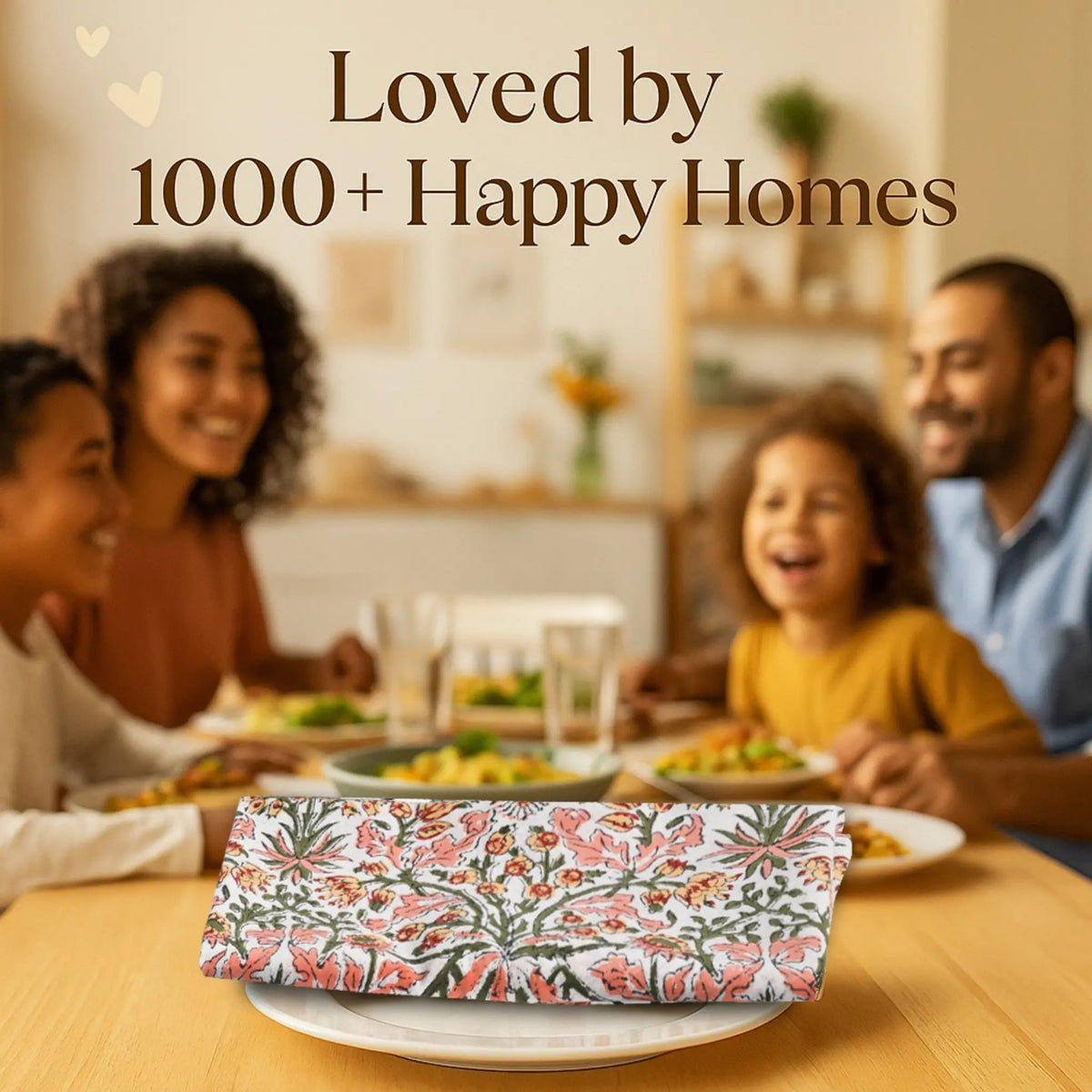 Family enjoying a meal together with a floral clutch on the table, text 'Loved by 1000+ Happy Homes' above.