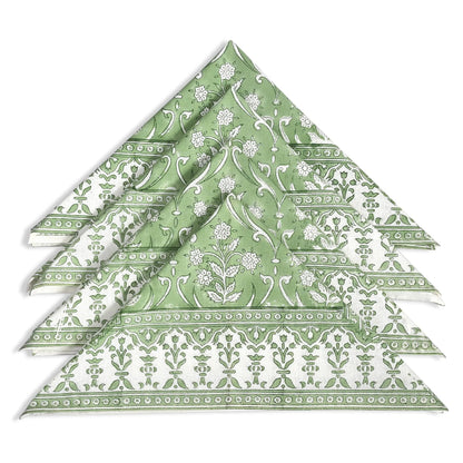 Stack of green patterned napkins on a white background
