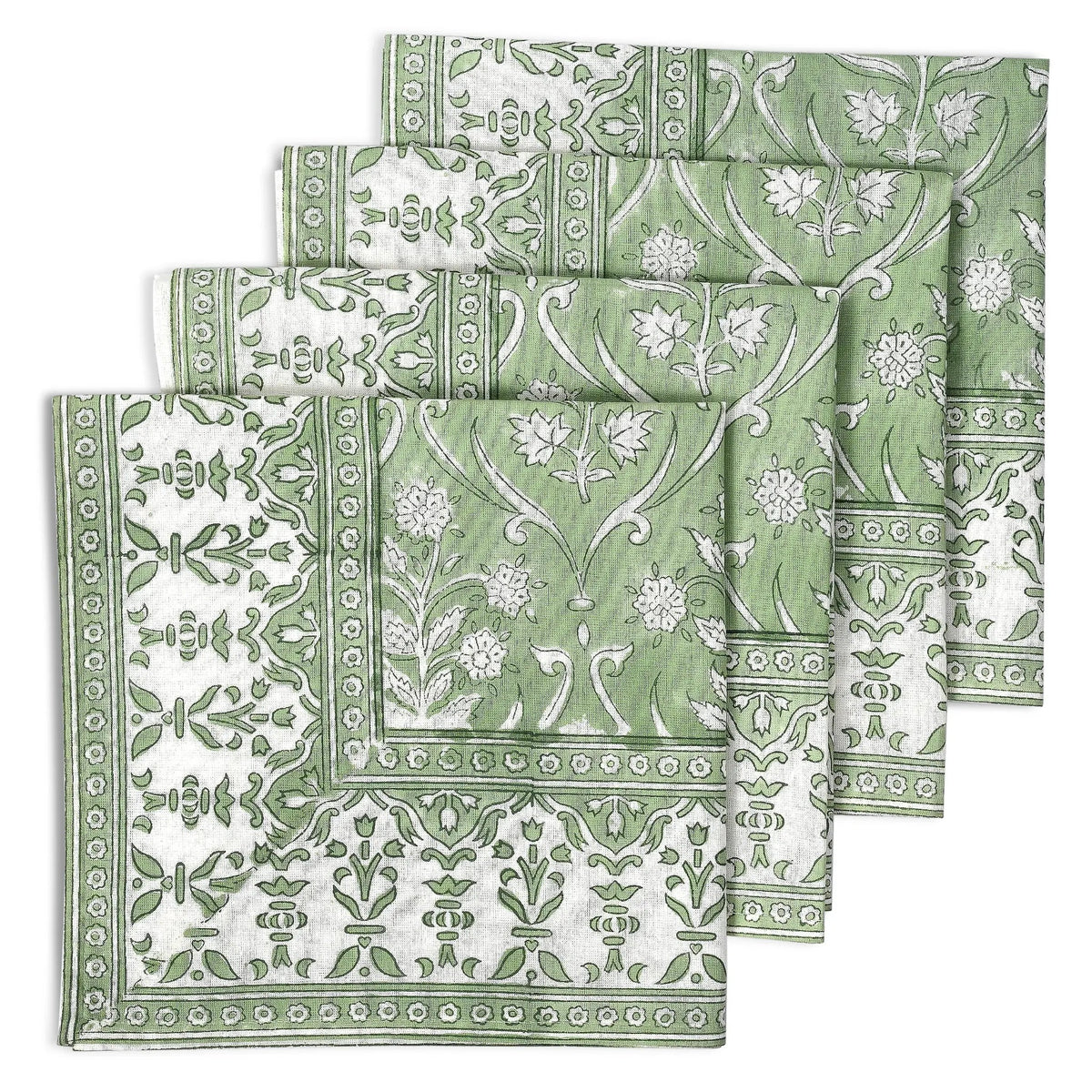 Set of green and white patterned napkins on a white background