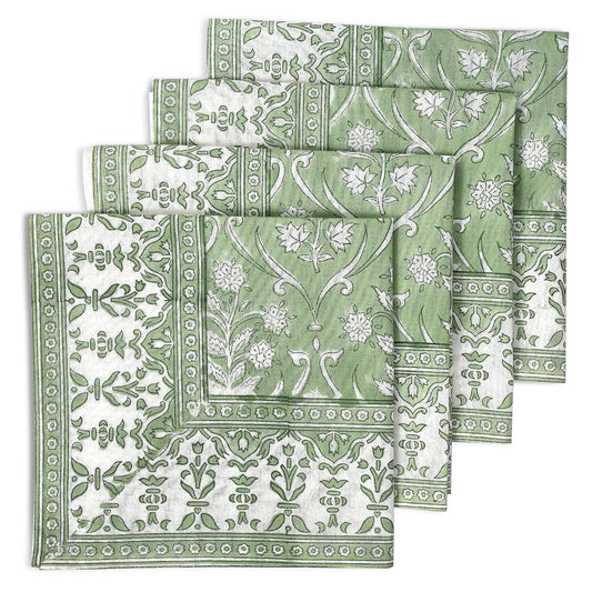 Set of green and white patterned napkins on a white background