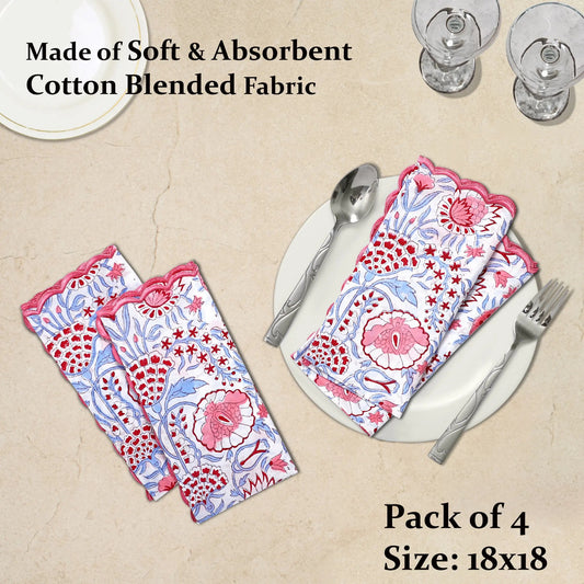 Pack of 4 floral patterned napkins on a beige surface with cutlery.