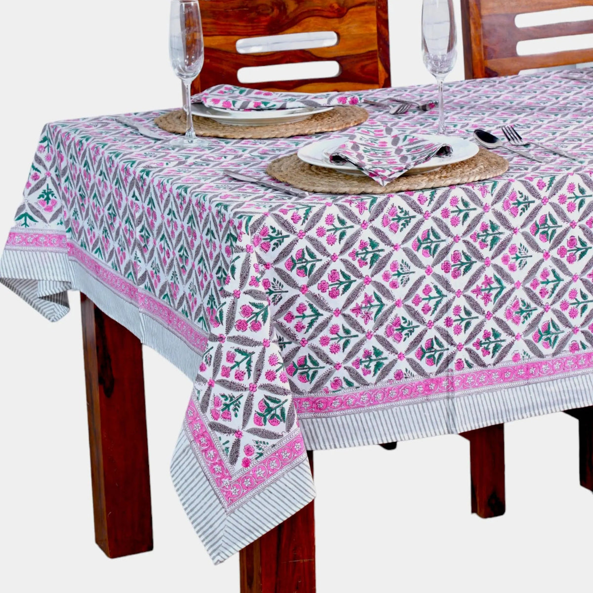 Tablecloth with geometric pattern on a wooden table and chairs