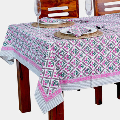 Tablecloth with geometric pattern on a wooden table and chairs