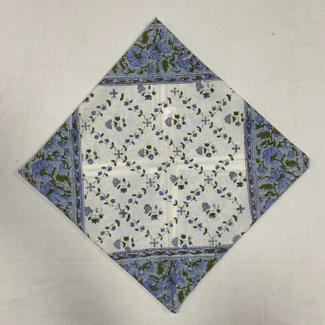 Floral patterned fabric square on a plain background