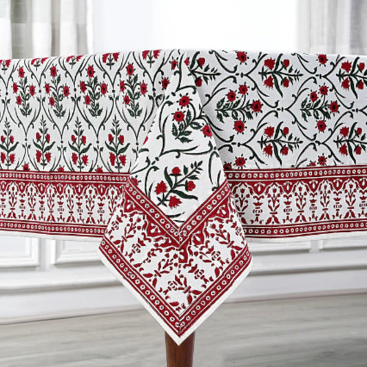 Decorative tablecloth with red and black floral patterns on a white background