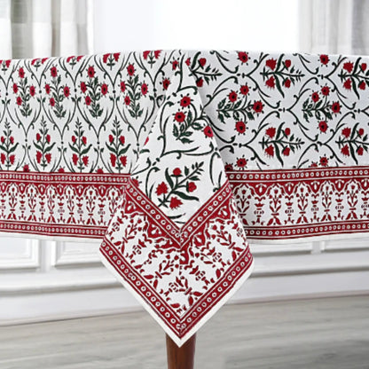 Decorative tablecloth with red and black floral patterns on a white background