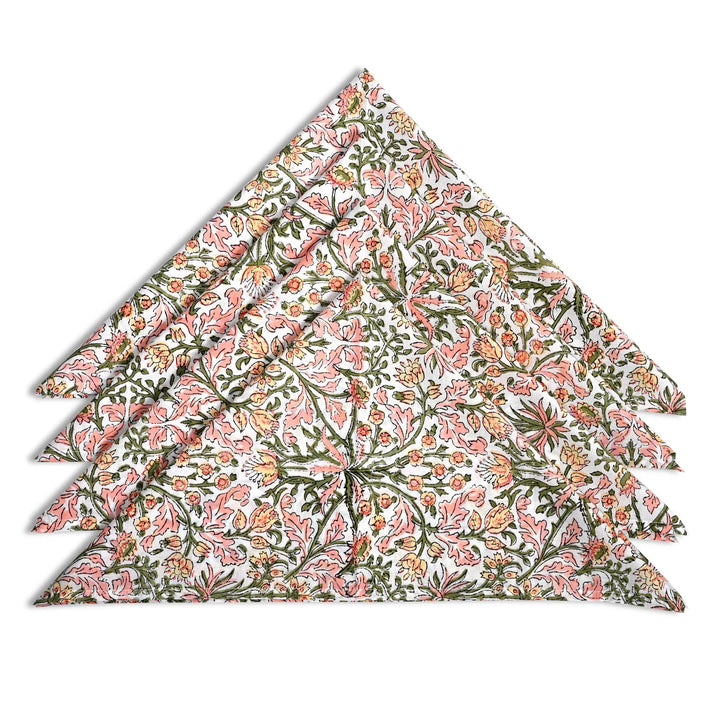 Floral patterned fabric folded into a triangle on a white background