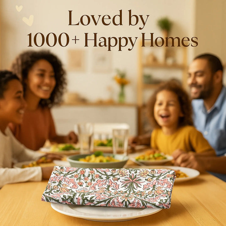 Family sitting around a dinner table with a floral-patterned clutch in the foreground, text &