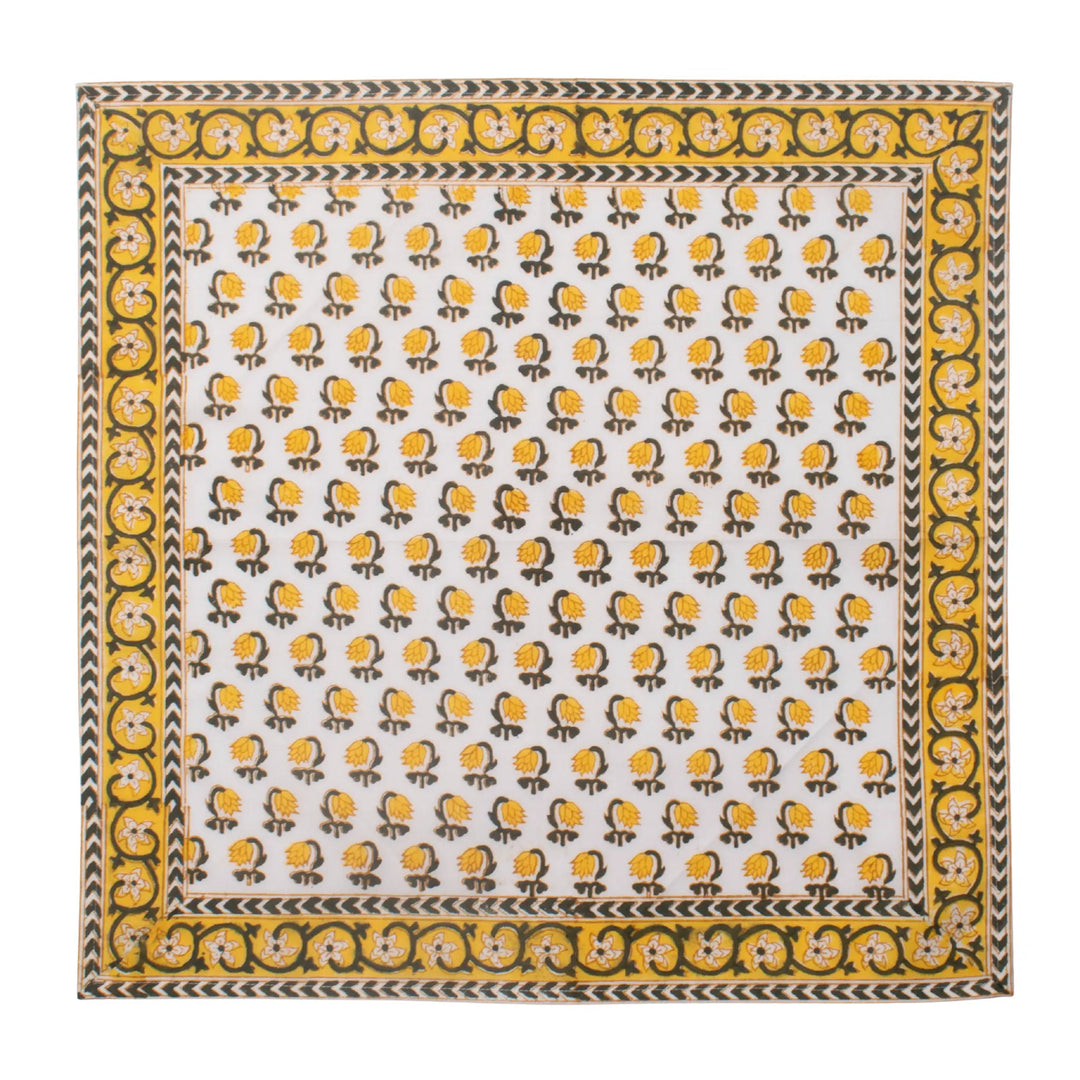 Patterned fabric with yellow and black design on a white background