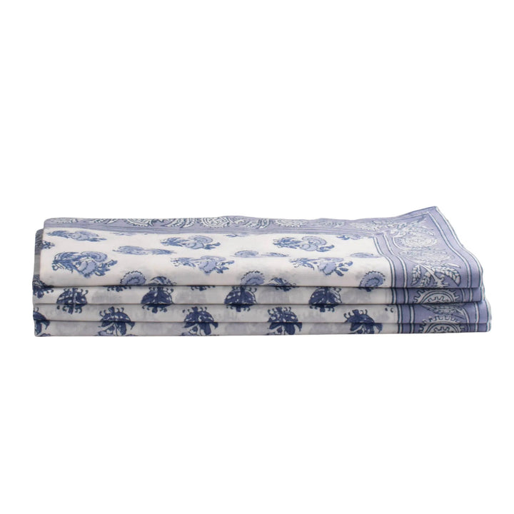 Folded fabric with blue floral patterns on a white background
