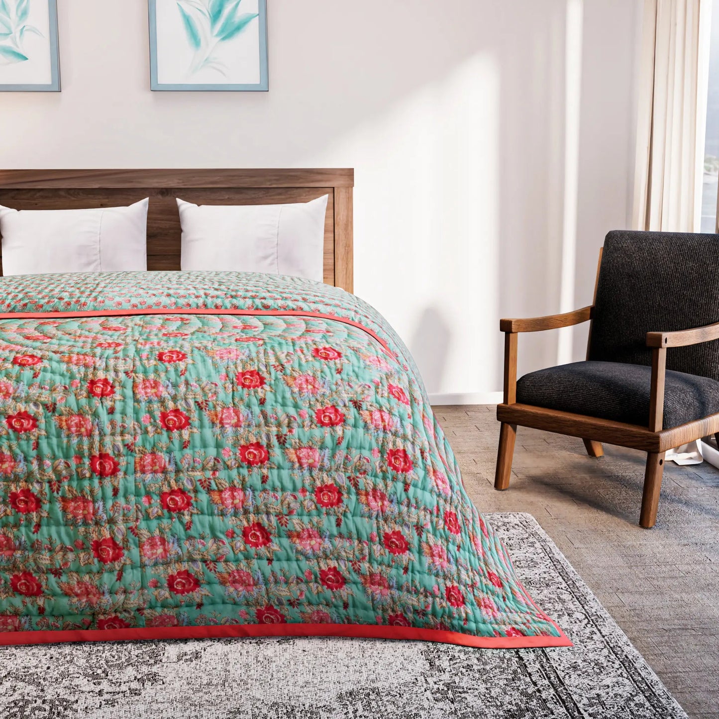 Bed with a floral quilt in a bedroom setting with a chair and artwork on the wall.