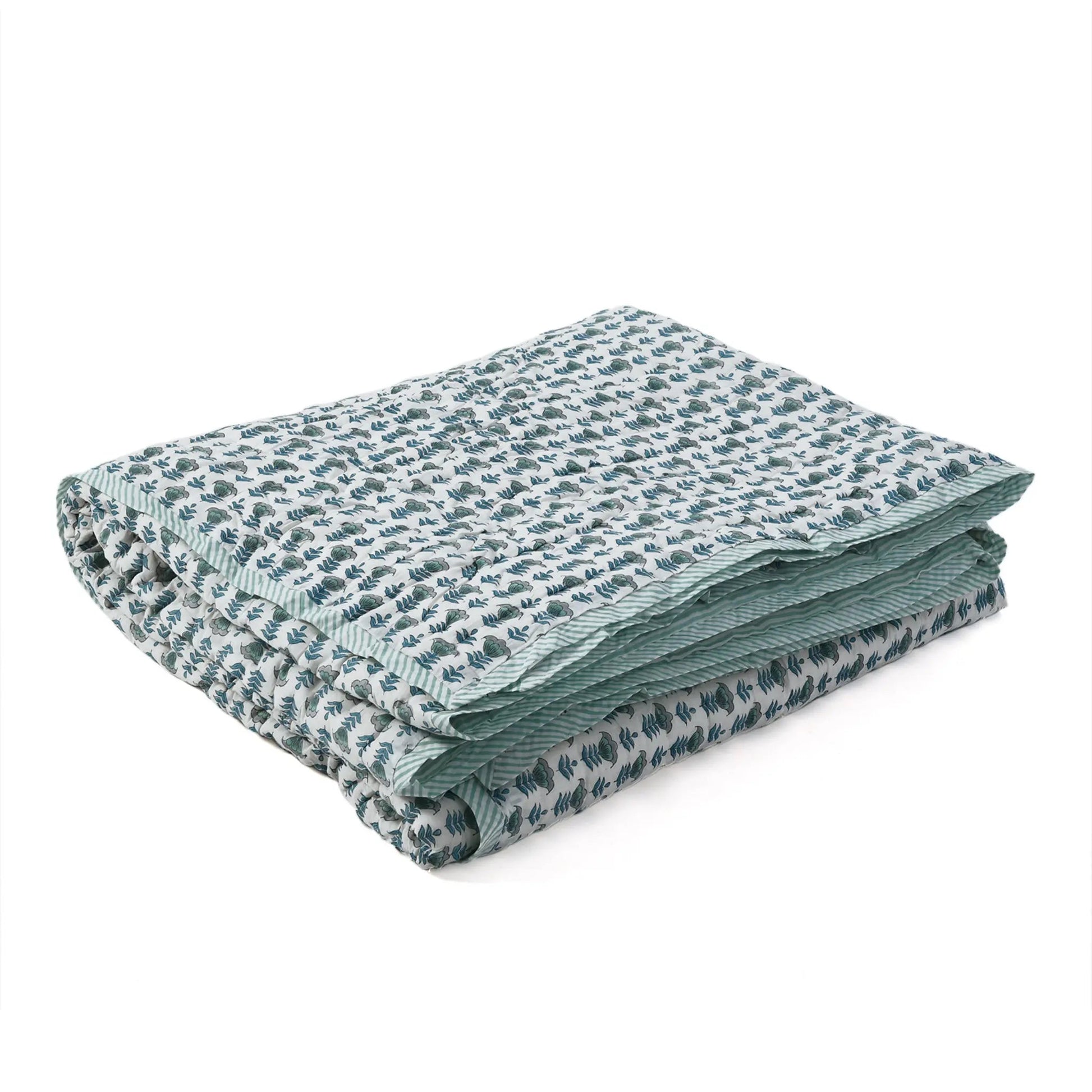 Folded fabric with a subtle pattern on a white background