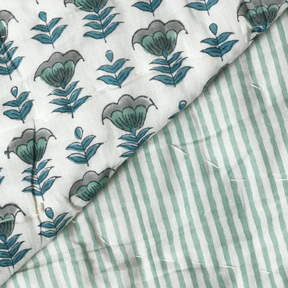 Fabric with floral and striped patterns on a white background