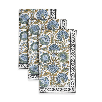 Set of three floral patterned napkins on a white background
