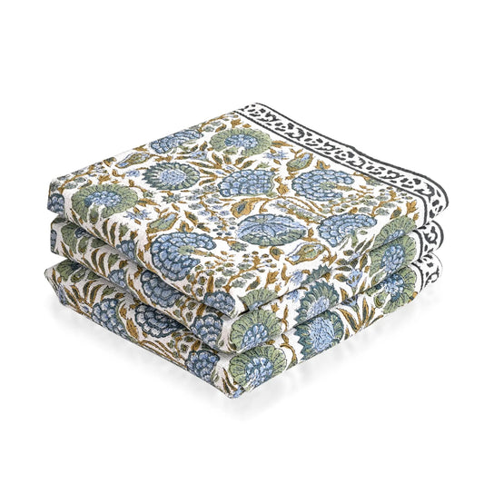 Set of three floral-patterned cushions on a white background