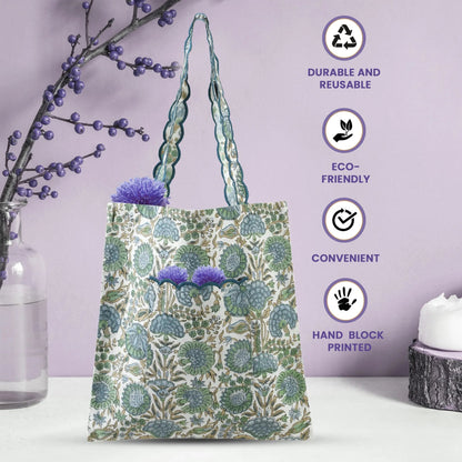 Reusable tote bag with floral design on a white surface with a purple background