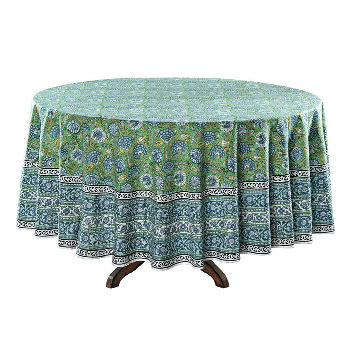 Round tablecloth with green and blue pattern on a white background