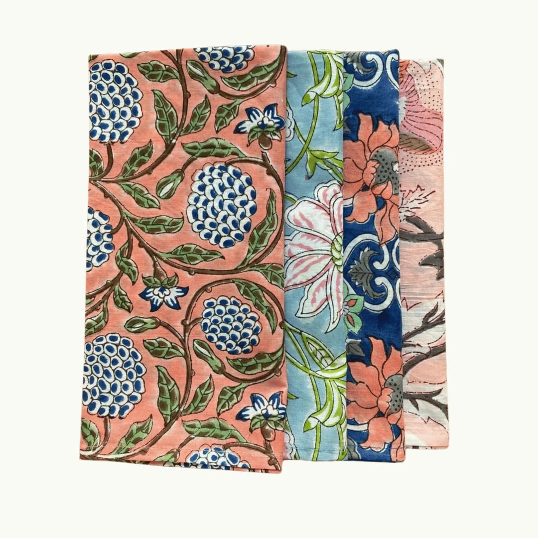 Two floral patterned fabric swatches on a white background