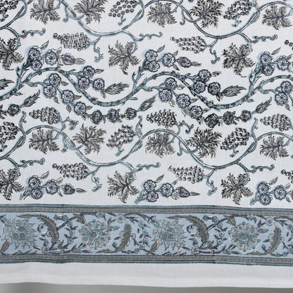 Decorative fabric with intricate floral and leaf patterns on a white background