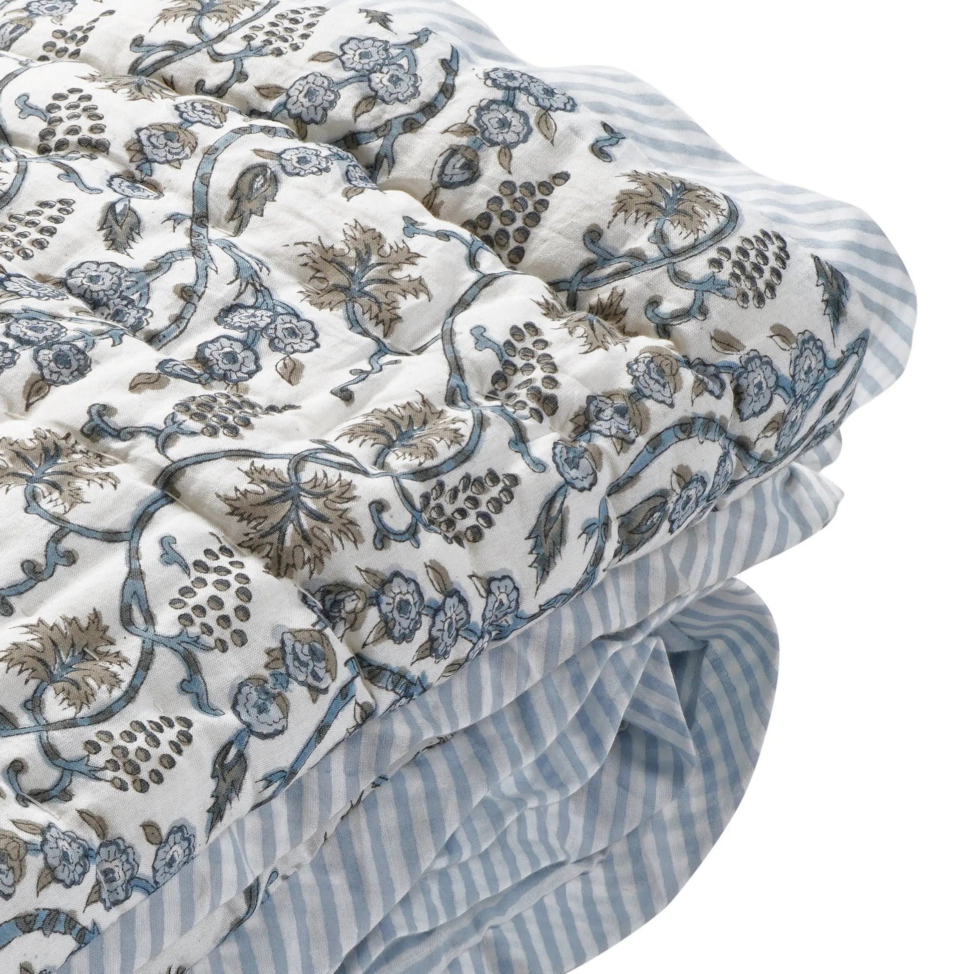 Floral and striped fabric with intricate patterns on a white background