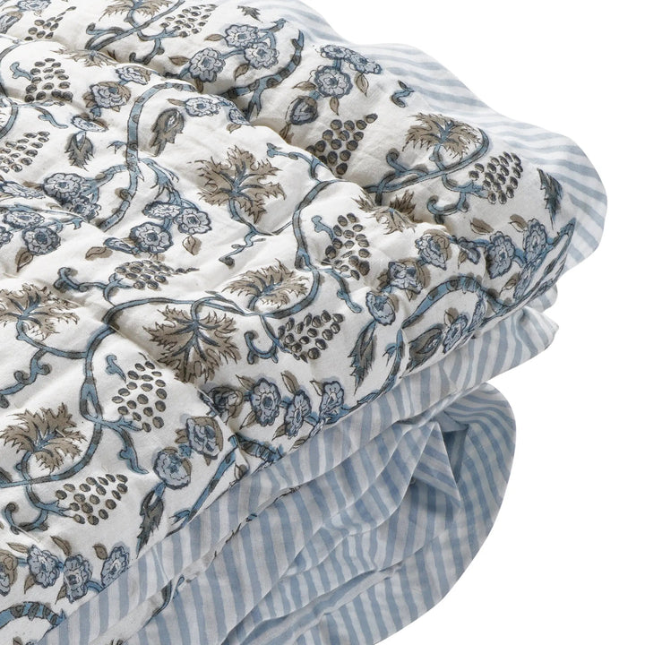 Floral and striped fabric with intricate patterns on a white background