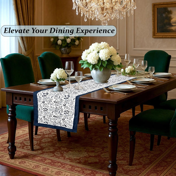 Dining room with a table set for dinner, flowers, and elegant decor.