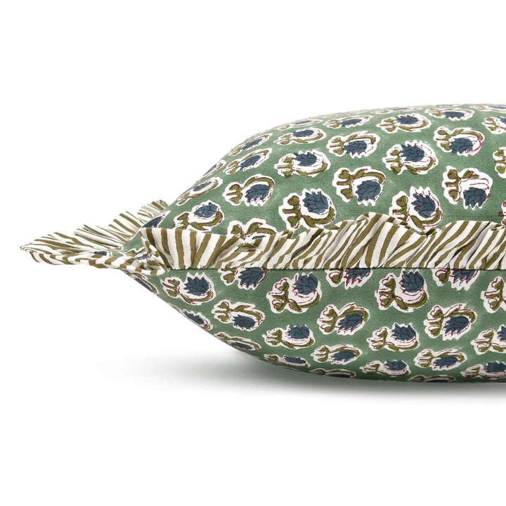 Decorative pillow with floral pattern on a green background