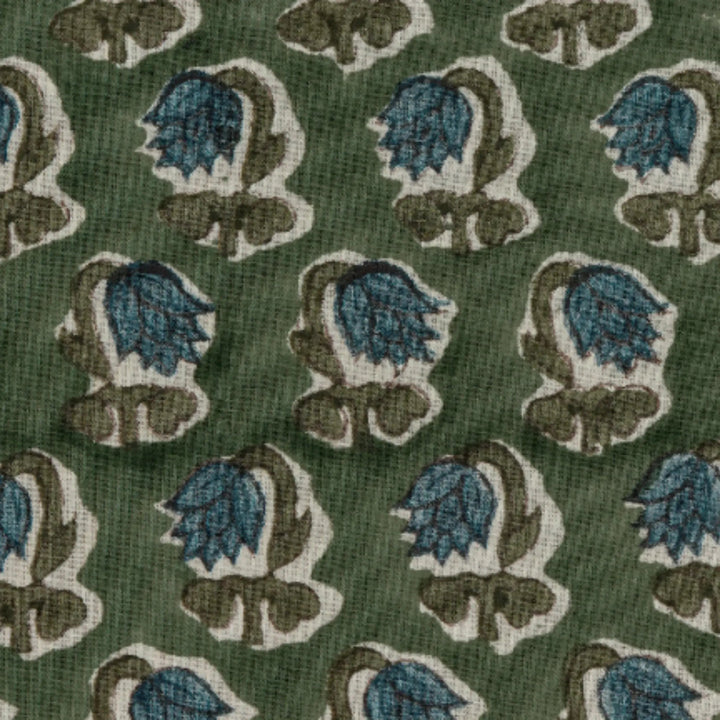 Patterned fabric with blue and brown floral design on a green background