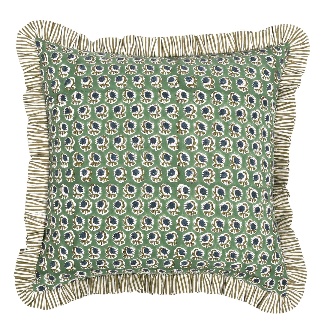 Decorative pillow with a green patterned cover and ruffled edge on a white background