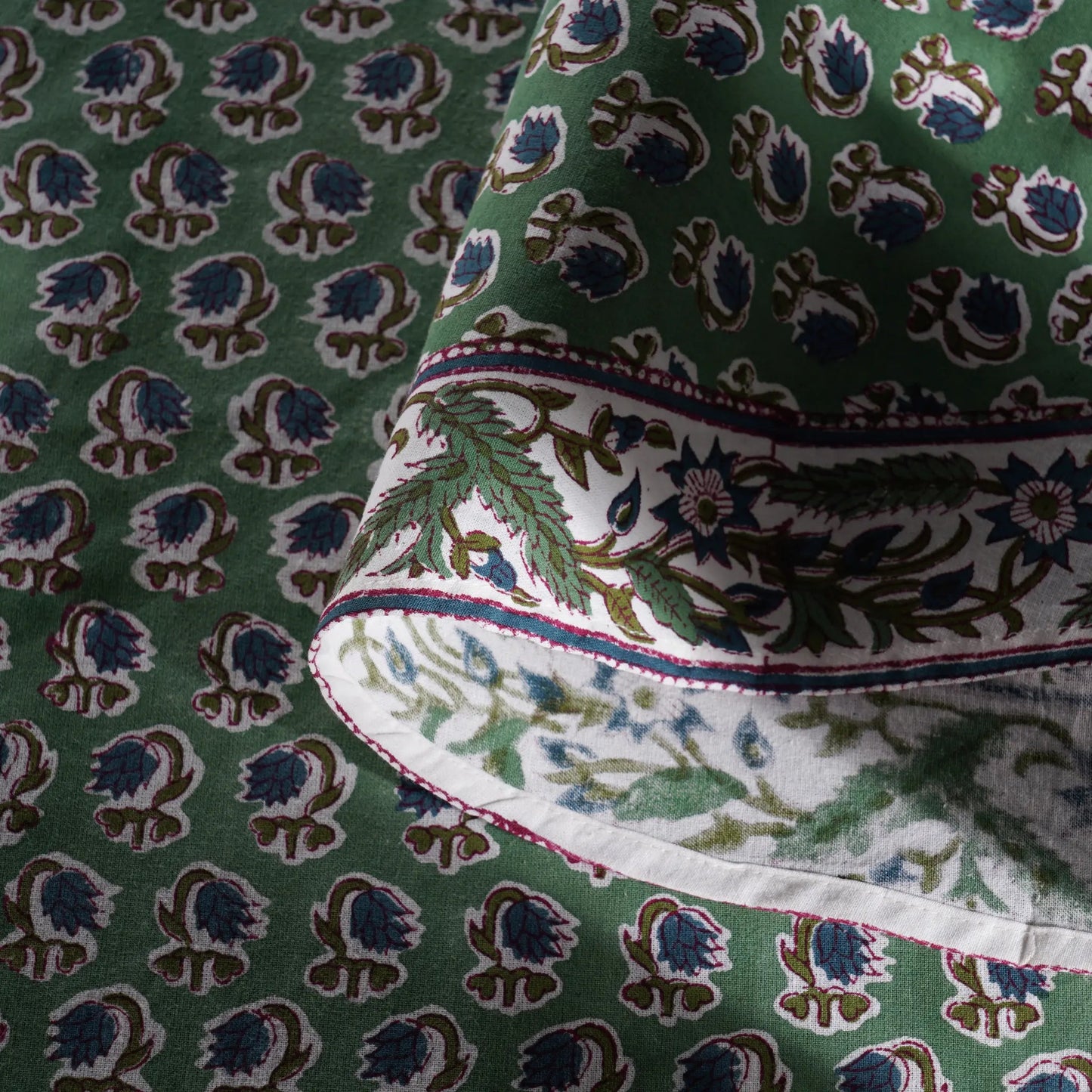 Close-up of green fabric with intricate pattern