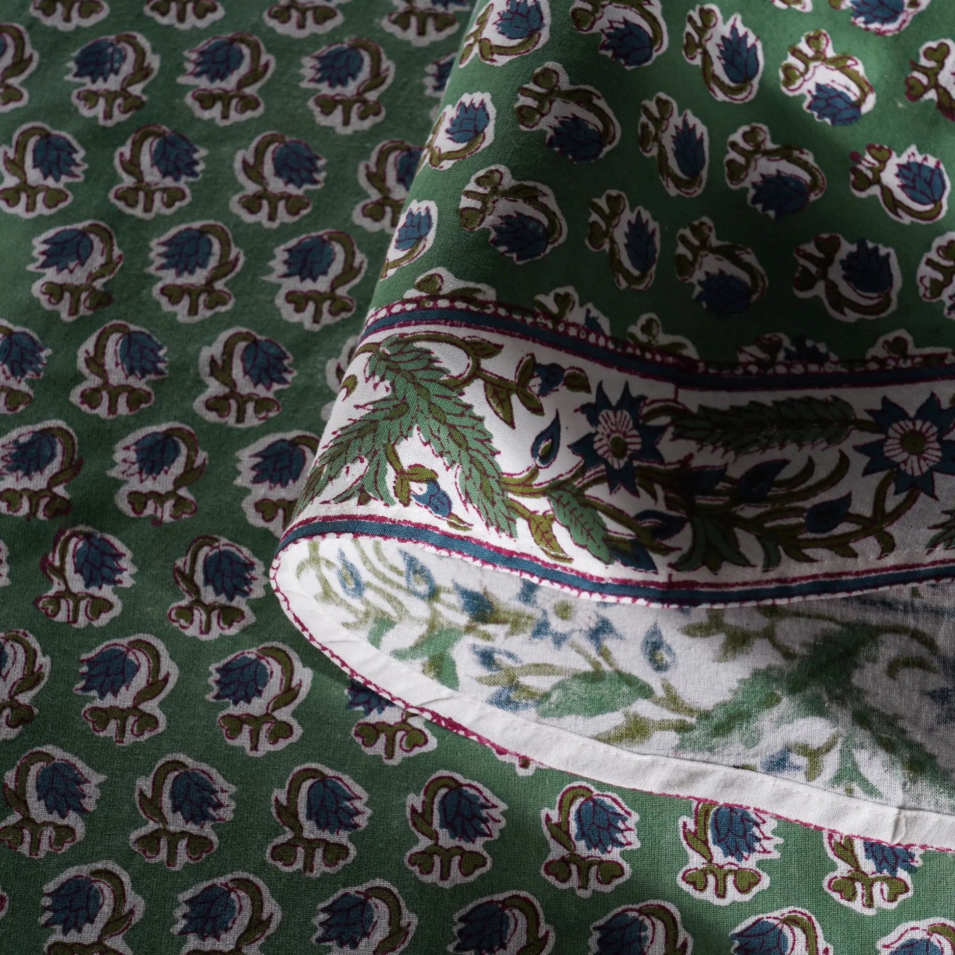 Close-up of green fabric with intricate pattern