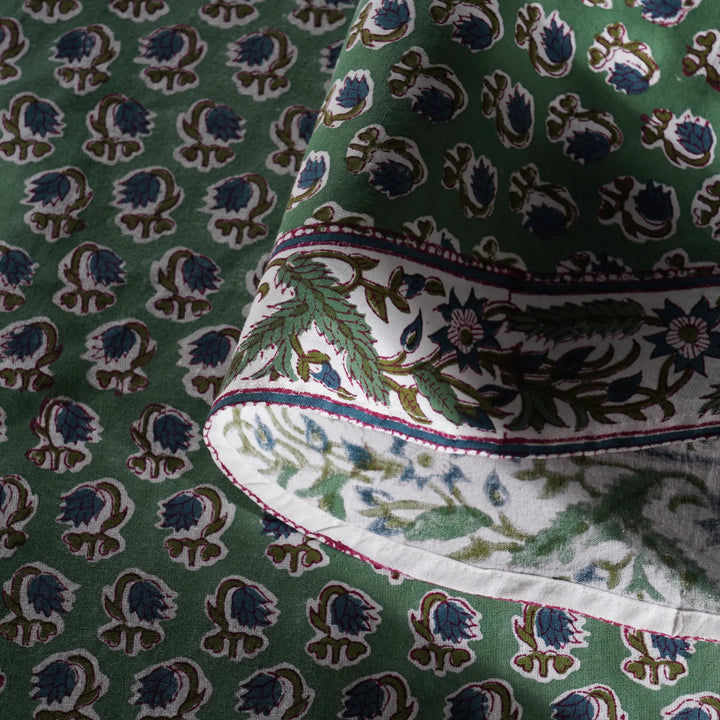 Close-up of green fabric with intricate pattern