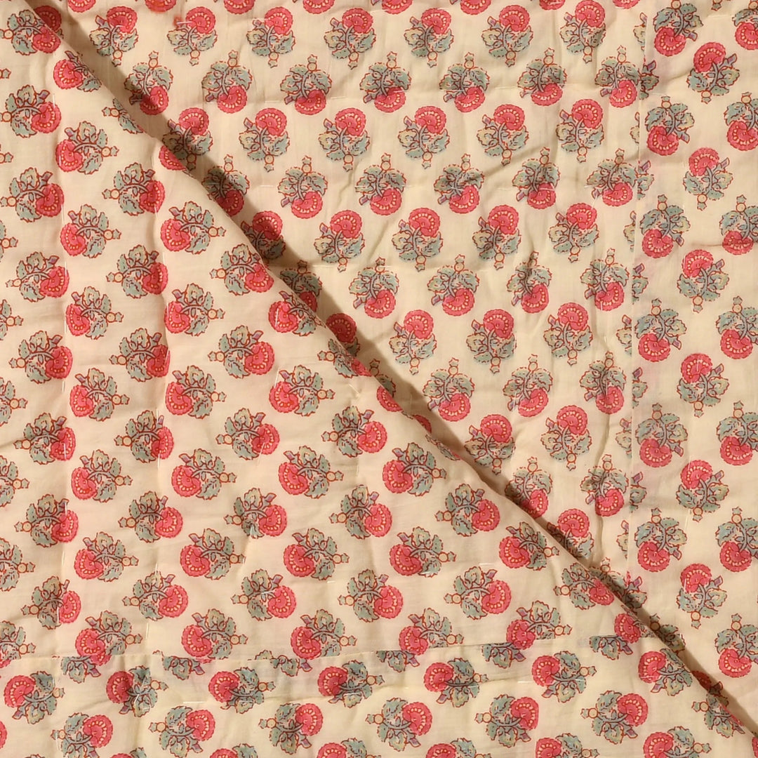 Fabric with a red and green pattern on a beige background