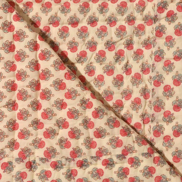 Fabric with a red and green pattern on a beige background