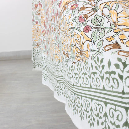 Floral and geometric patterned fabric on a light wooden floor