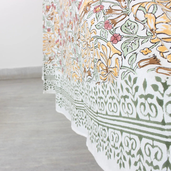 Floral and geometric patterned fabric on a light wooden floor