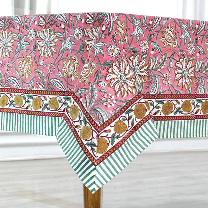 Floral and striped tablecloth on a wooden table